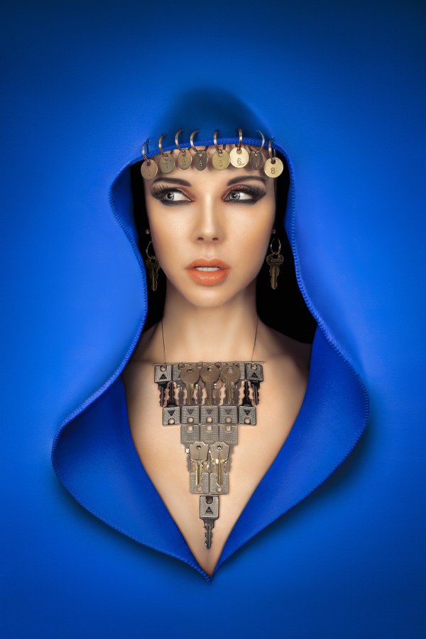 Beautiful arabic style woman with a glamorous makeup wearing a blue veil and keys as jewels by Artmood Visualz